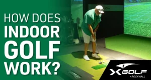 How does indoor golf work? X-Golf Rockwall indoor golfing simulator with man playing golf indoors