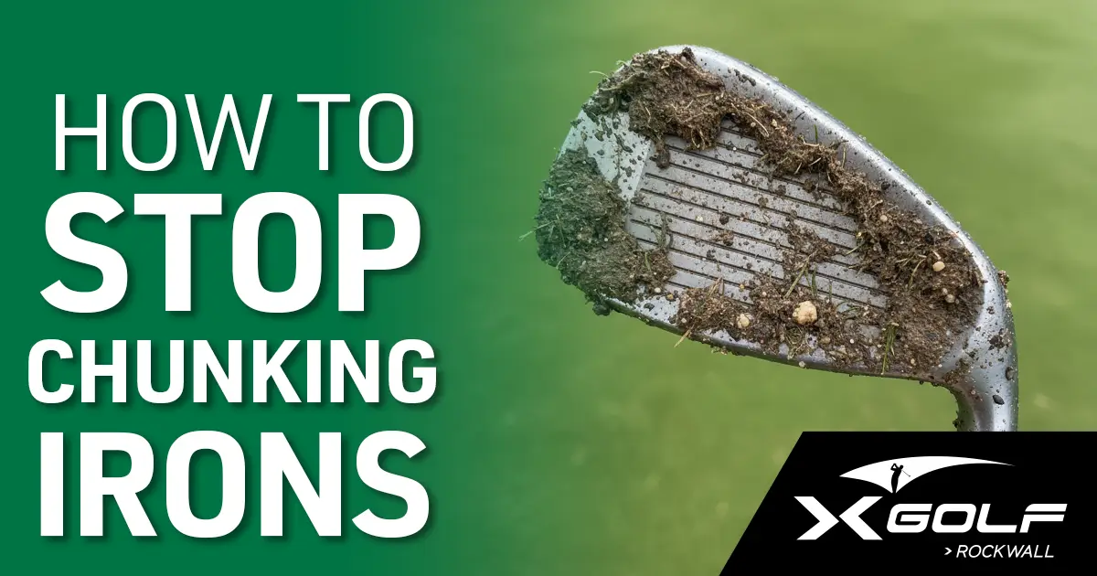 Golf club face covered in dirt and grass after a chunked shot.