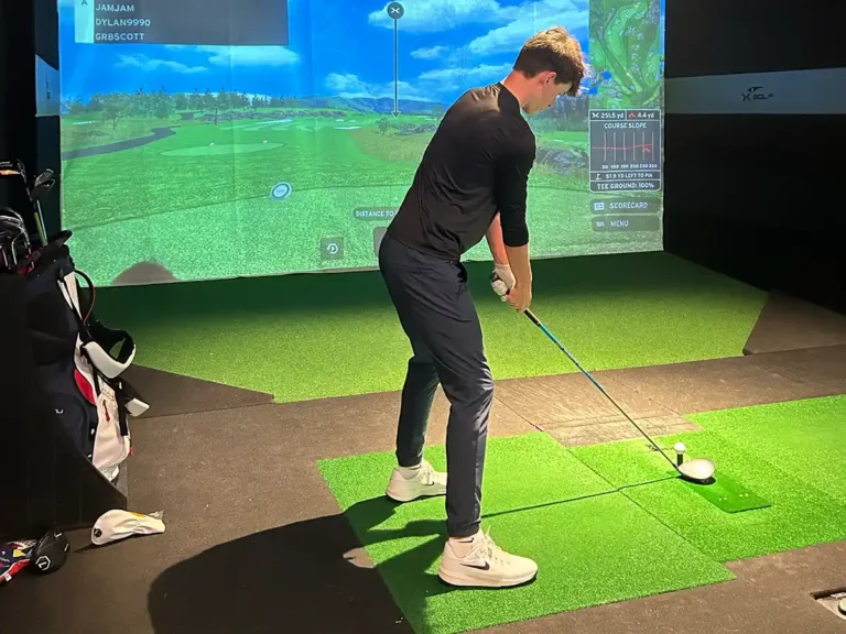 League player addresses his tee shot as the simulator displays 251 yards to the pin and course slope data.
