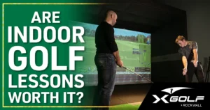 Are Indoor Golf Lessons Worth It? Instructor watches student practice swing with simulator data displayed.