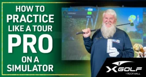 Man with white beard holding a golf club on his shoulder, standing in front of a golf simulator screen showing "John Daly" gameplay; text overlay reads "How to Practice Like a Tour Pro on a Simulator" with XGolf Rockwall logo